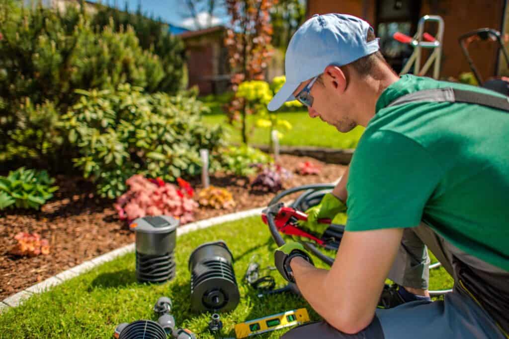 adjusting-hoses-for-garden-watering-system-2023-11-27-05-05-34-utc-Y4LVR2pG5wTLxLNY (1) - losangelesgardenpros.com